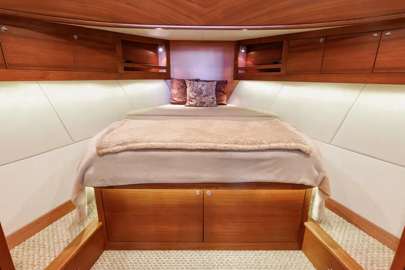 Slide: The Image of Luxurious cabin interior of 2019 Grand Banks 44 Eastbay SX yacht, featuring elegant wood finishes. - 42
