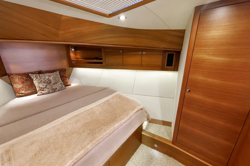 Slide: The Image of Luxurious cabin interior of 2019 Grand Banks 44 Eastbay SX yacht with wooden finishes. - 44