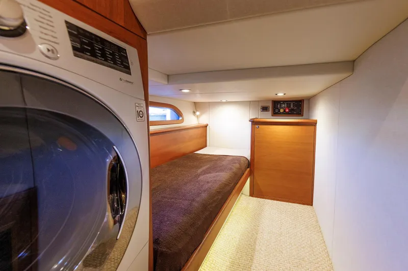 Slide: The Image of 2019 Grand Banks 44 Eastbay SX cabin with bed and washer-dryer unit. - 50
