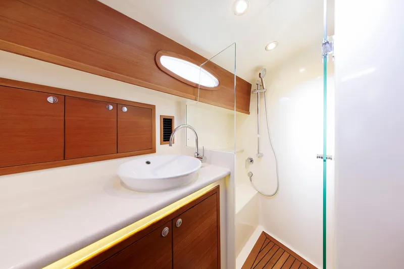 Slide: The Image of Luxurious bathroom in 2019 Grand Banks 44 Eastbay SX yacht with modern fixtures. - 53
