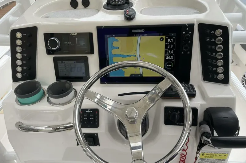 Slide: The Image of Control panel of 2022 Robalo 246 Cayman SD with navigation and steering features. - 30