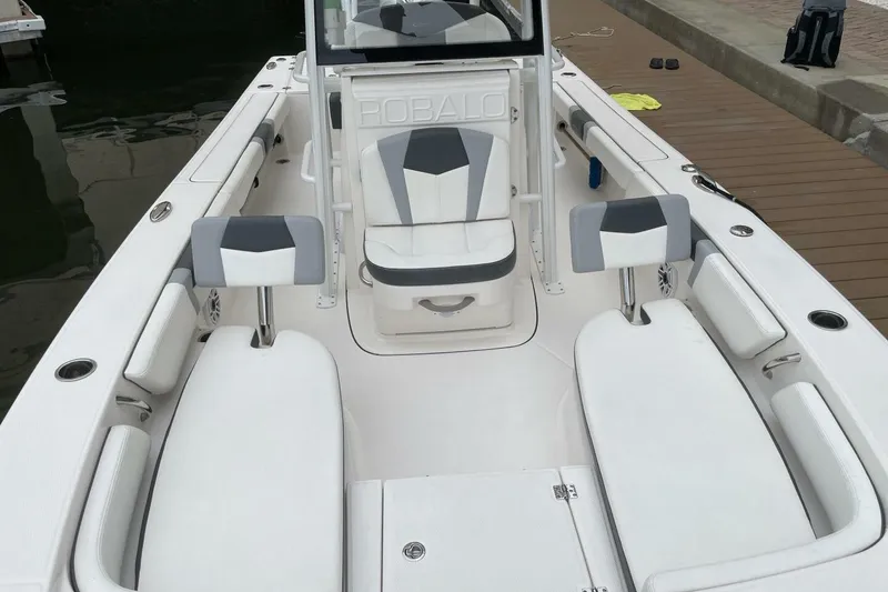 Slide: The Image of 2022 Robalo 246 Cayman SD boat interior with white and gray seating. - 37