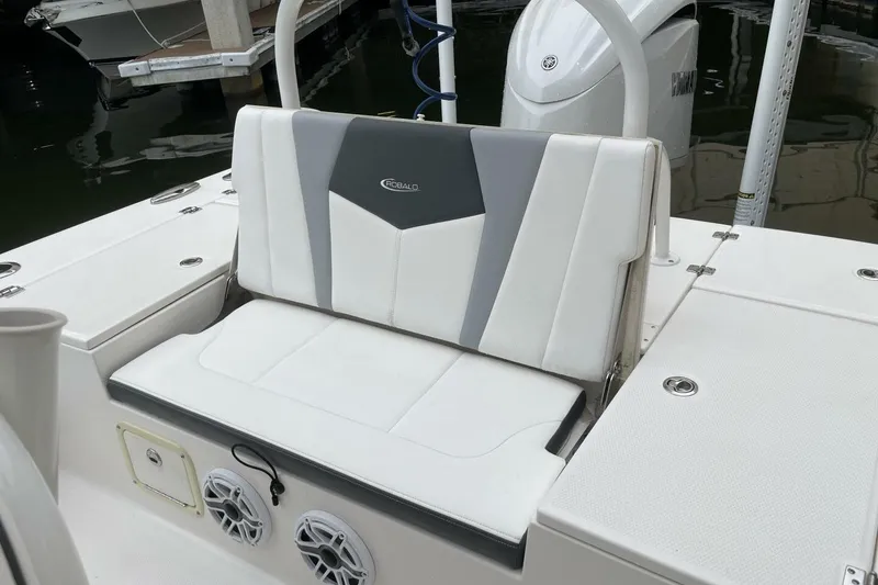 Slide: The Image of 2022 Robalo 246 Cayman SD boat seat with sleek white and gray design. - 41