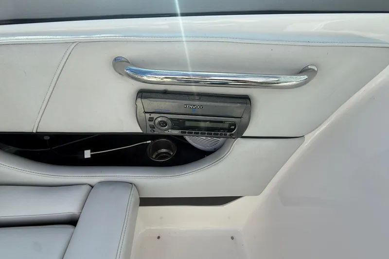 Slide: The Image of 2008 Regal 2520 FasDeck interior with Kenwood stereo and sleek chrome handle. - 14