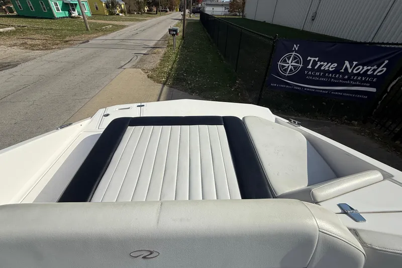 Slide: The Image of 2008 Regal 2520 FasDeck boat interior with white and black seating, near True North Yacht Sales. - 18