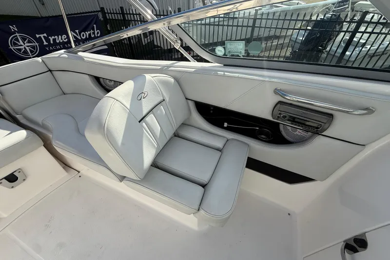 Slide: The Image of 2008 Regal 2520 FasDeck boat interior with white seating and audio system. - 20