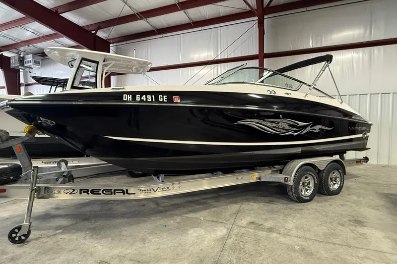 Slide: The Image of 2008 Regal 2520 FasDeck boat on trailer in indoor storage facility. - 21