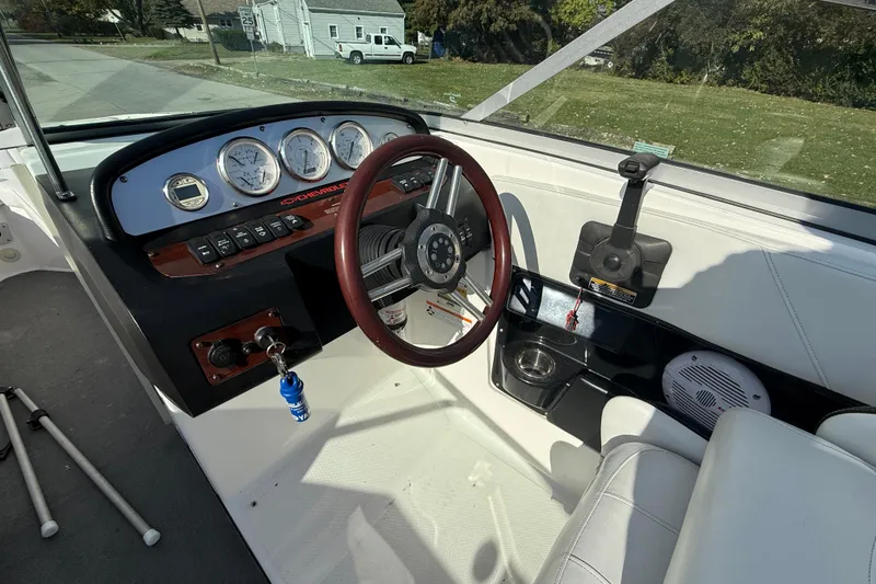 Slide: The Image of Interior view of 2008 Regal 2520 FasDeck boat dashboard with steering wheel and gauges. - 22