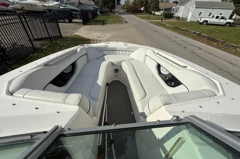 Slide: The Image of 2008 Regal 2520 FasDeck boat with spacious white seating and cup holders. - 28