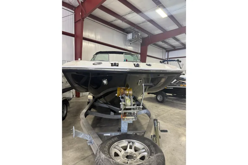 Slide: The Image of 2008 Regal 2520 FasDeck boat on trailer in indoor storage facility. - 30