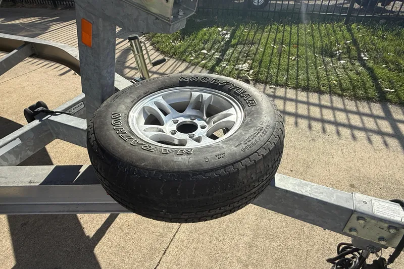 Slide: The Image of Spare tire on a trailer for a 2008 Regal 2520 FasDeck boat. - 6