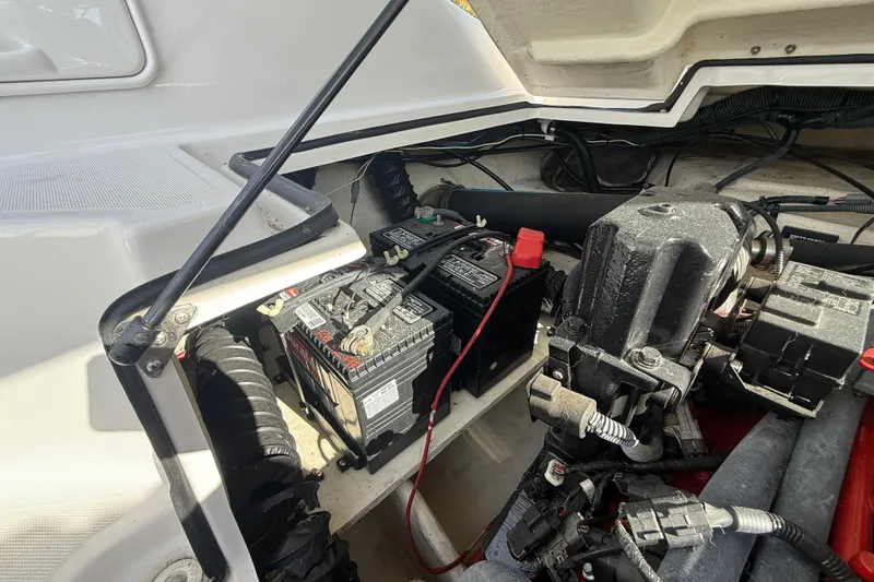Slide: The Image of 2008 Regal 2520 FasDeck boat engine compartment with battery and wiring. - 8
