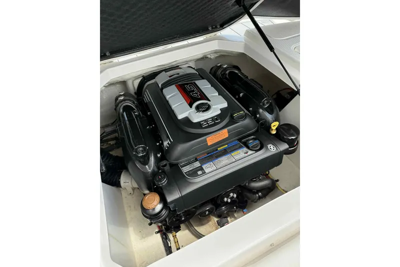 Slide: The Image of 2021 Chaparral 216 SSi boat cockpit with steering wheel and dashboard controls. - 11