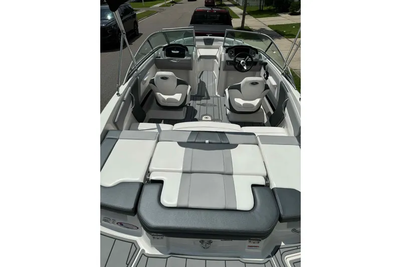 Slide: The Image of 2021 Chaparral 216 SSi boat stern view with propeller and outdrive. - 8