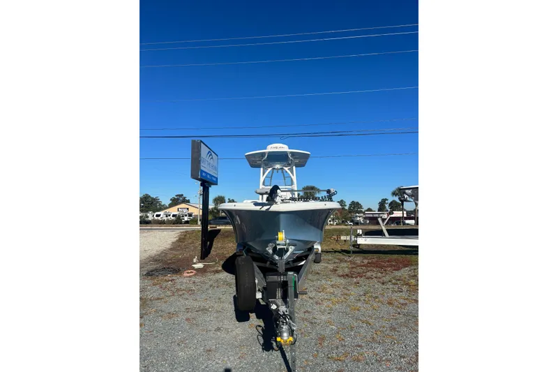 Slide: The Image of 2026 Yellowfin 26 Hybrid boat on trailer under clear blue sky. - 23