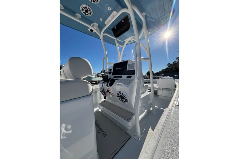 Slide: The Image of 2026 Yellowfin 26 Hybrid boat interior with Garmin electronics under a sunny sky. - 27