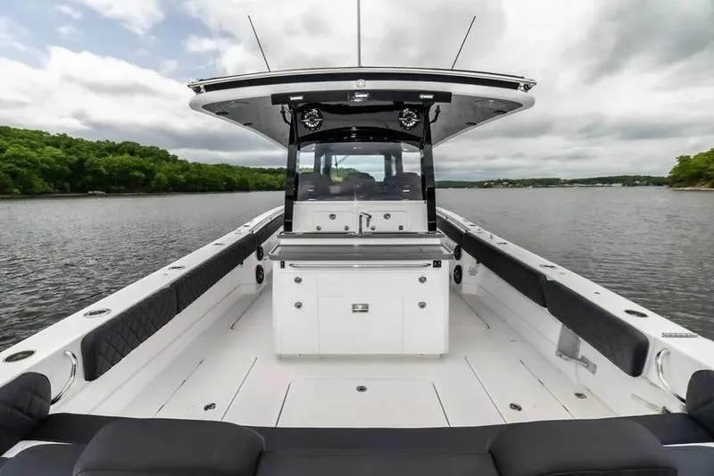 Slide: The Image of 2024 HCB 42 Lujo boat interior with sleek design on a calm lake. - 11