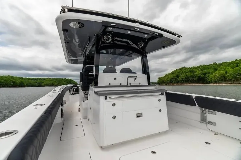 Slide: The Image of 2024 HCB 42 Lujo boat on water, featuring sleek design and modern amenities. - 12