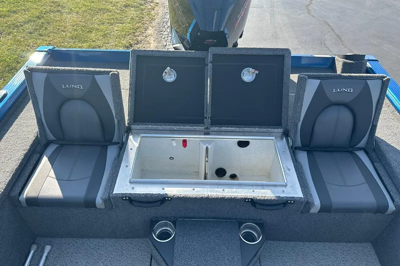 Slide: The Image of 2024 Lund 2075 Pro-V Bass XS boat interior with storage compartments and seating. - 12
