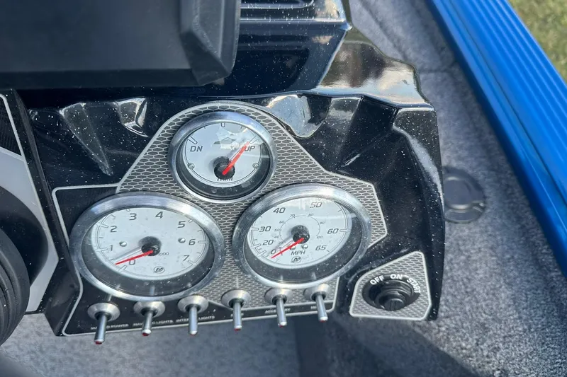 Slide: The Image of Dashboard of 2024 Lund 2075 Pro-V Bass XS boat with gauges and switches. - 16