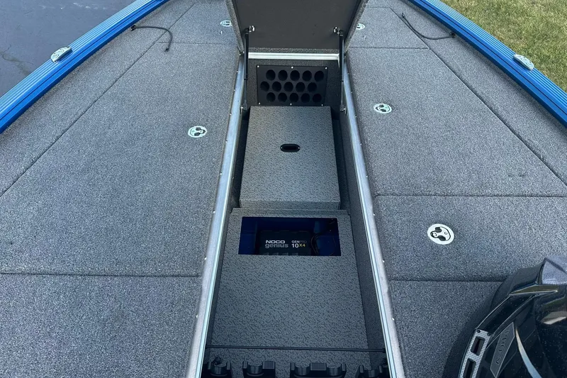 Slide: The Image of 2024 Lund 2075 Pro-V Bass XS boat interior with storage compartments open. - 18