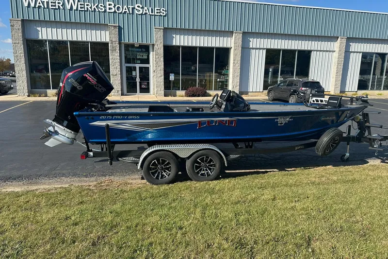 Slide: The Image of 2024 Lund 2075 Pro-V Bass XS boat at Water Werks Boat Sales dealership. - 2