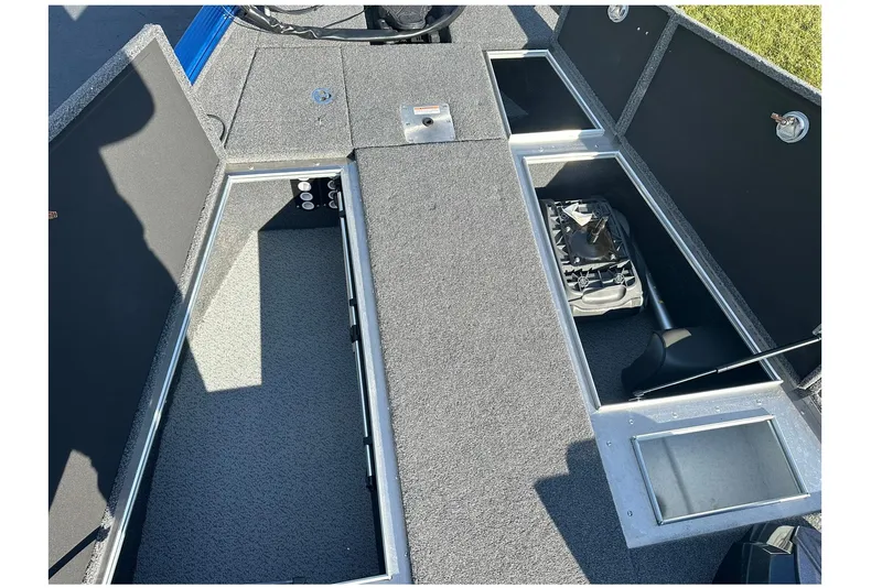 Slide: The Image of 2024 Lund 2075 Pro-V Bass XS boat interior storage compartments, open and spacious design. - 22