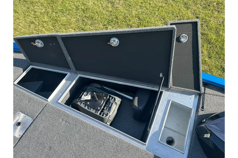 Slide: The Image of 2024 Lund 2075 Pro-V Bass XS boat storage compartments open, showcasing interior features. - 24