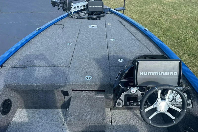 Slide: The Image of 2024 Lund 2075 Pro-V Bass XS boat interior with Humminbird electronics and steering wheel. - 7