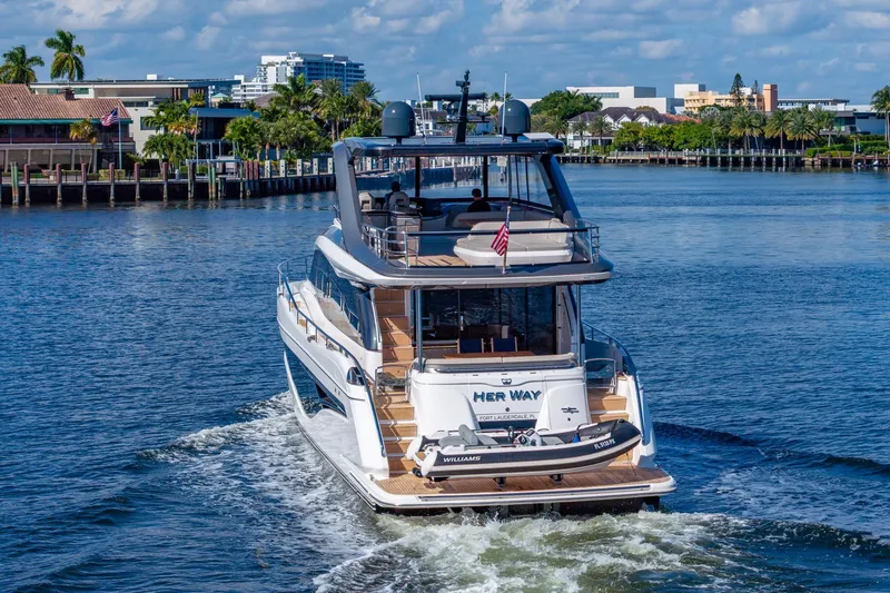 Slide: The Image of Luxury 2023 Princess Y72 yacht cruising in scenic waterfront setting. - 12