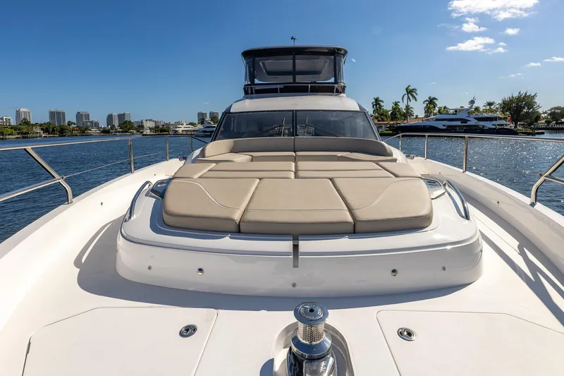 Slide: The Image of Luxurious 2023 Princess Y72 yacht with sunbathing deck, cruising on a sunny day. - 23