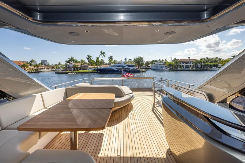 Slide: The Image of Luxurious 2023 Princess Y72 yacht deck with waterfront view and elegant seating area. - 33