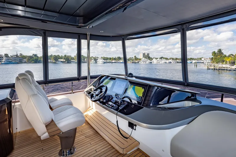 Slide: The Image of Luxurious 2023 Princess Y72 yacht helm with panoramic water views and modern navigation equipment. - 35