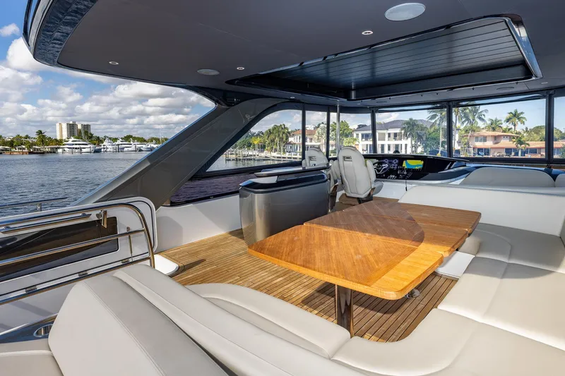 Slide: The Image of Luxurious 2023 Princess Y72 yacht interior with elegant seating and scenic waterfront views. - 37