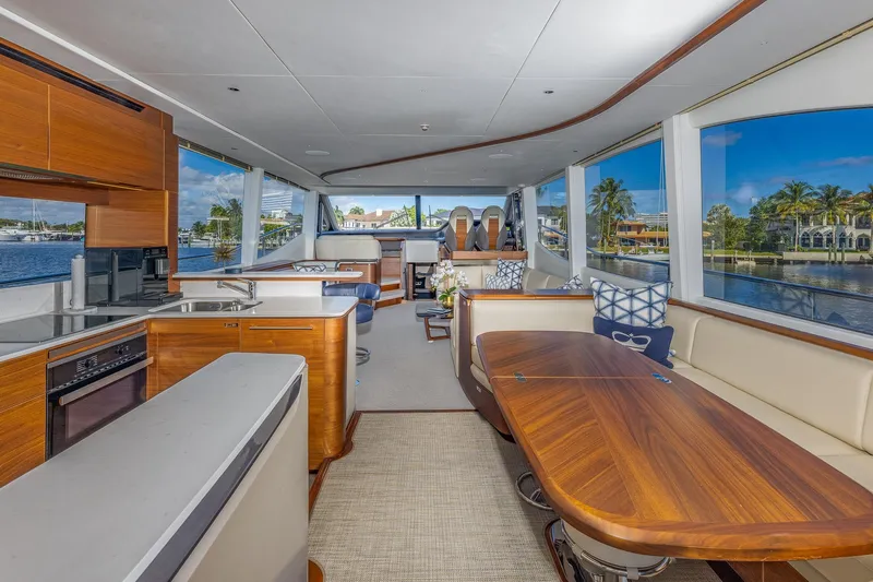 Slide: The Image of Luxurious interior of 2023 Princess Y72 yacht with elegant wood finishes and panoramic windows. - 38