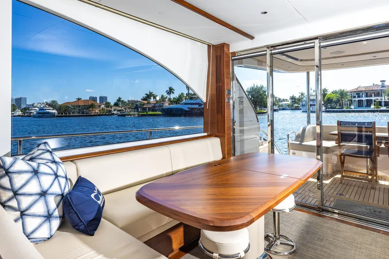 Slide: The Image of Luxurious 2023 Princess Y72 yacht interior with elegant seating and scenic waterfront view. - 40