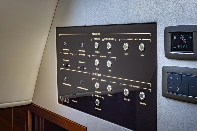 Slide: The Image of Control panel of 2023 Princess Y72 yacht, featuring AC and DC systems. - 48