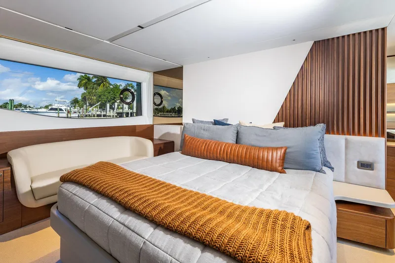 Slide: The Image of Luxurious 2023 Princess Y72 yacht bedroom with elegant decor and scenic window view. - 50
