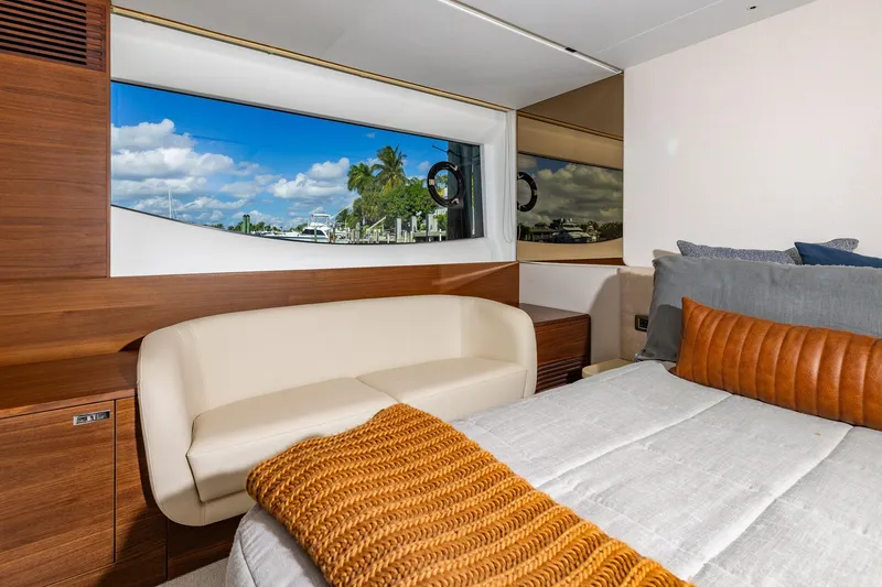 Slide: The Image of Luxurious 2023 Princess Y72 yacht interior with elegant seating and scenic window view. - 52