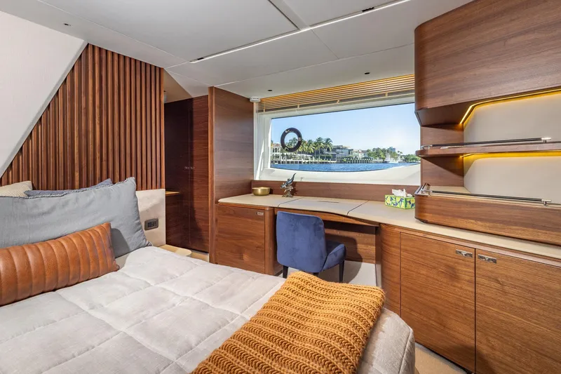 Slide: The Image of Luxurious 2023 Princess Y72 yacht interior with elegant wood finishes and scenic window view. - 53