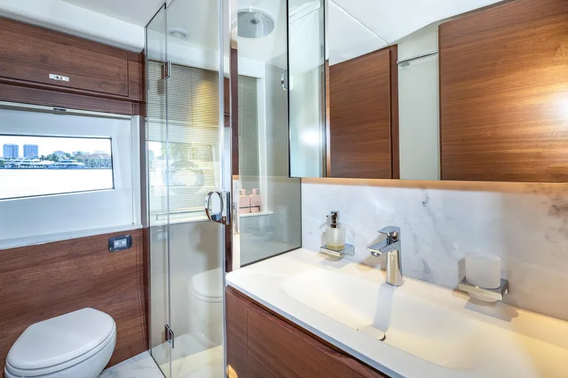 Slide: The Image of Luxurious bathroom in 2023 Princess Y72 yacht with modern fixtures and wooden accents. - 65