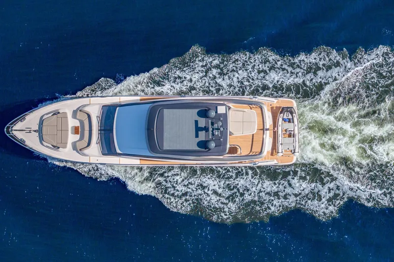 Slide: The Image of Aerial view of 2023 Princess Y72 yacht cruising on open water. - 8