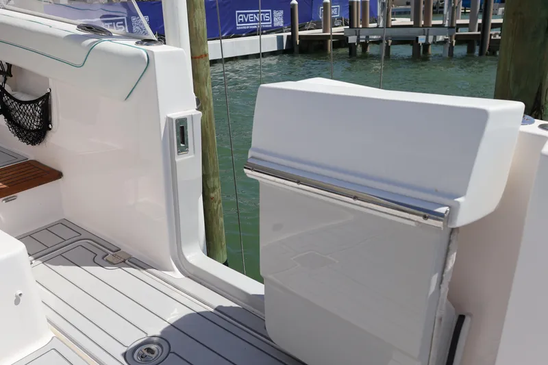 Slide: The Image of 2022 Regal 38 SAV boat with open side door and steps leading to water. - 32