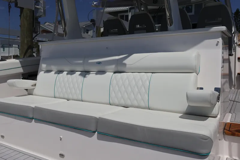 Slide: The Image of Luxurious seating on 2022 Regal 38 SAV boat with quilted white upholstery. - 36