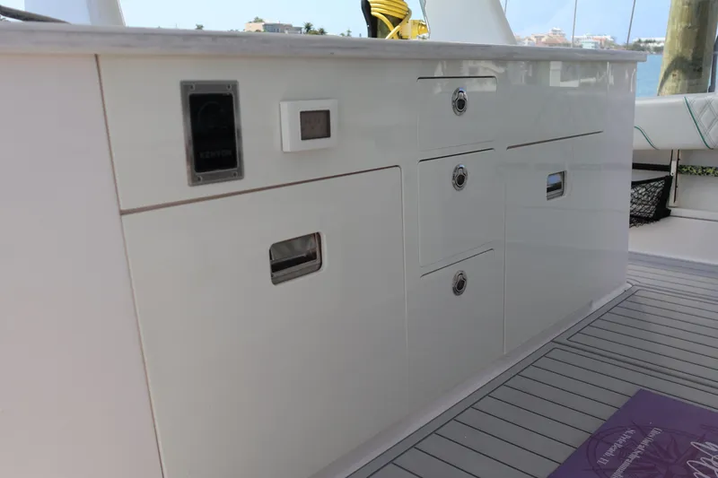 Slide: The Image of 2022 Regal 38 SAV boat interior with sleek white cabinetry and modern design. - 42