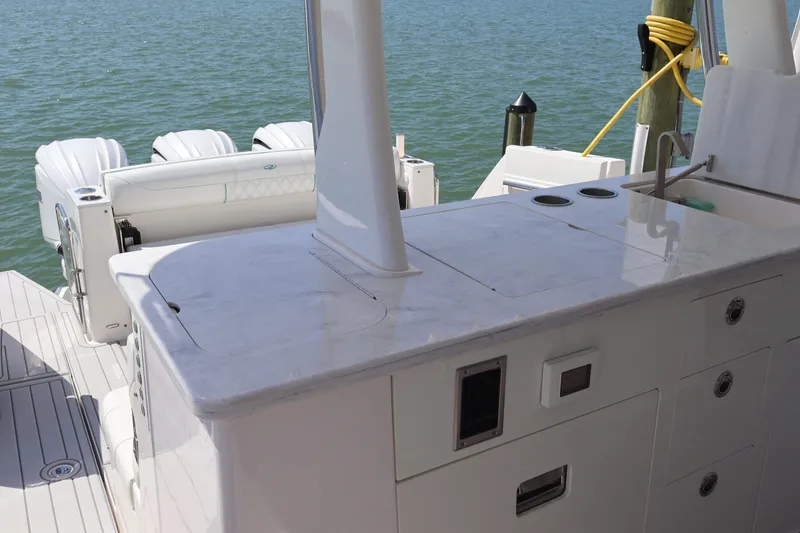 Slide: The Image of 2022 Regal 38 SAV boat interior with sleek white cabinetry and modern design. - 43