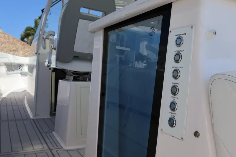 Slide: The Image of 2022 Regal 38 SAV boat with open storage compartment and seating area. - 50