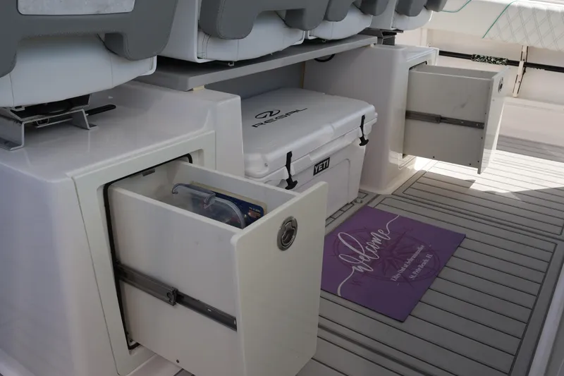 Slide: The Image of 2022 Regal 38 SAV boat interior with modern helm and luxurious seating. - 60