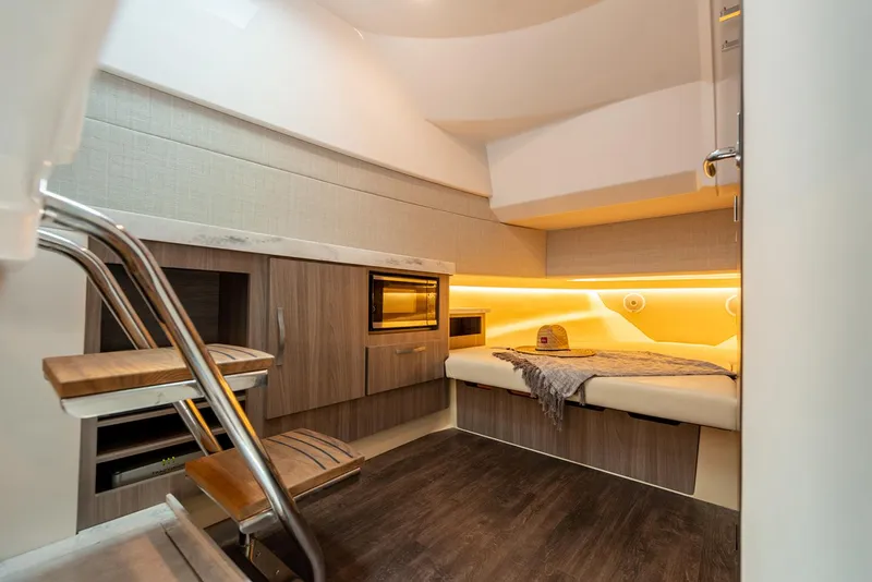 Slide: The Image of 2022 Regal 38 SAV boat deck with wooden panel and storage net. - 74
