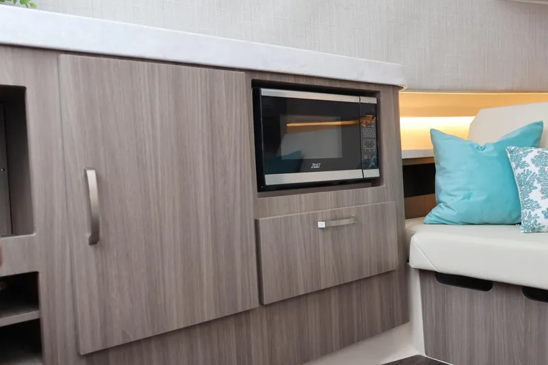 Slide: The Image of Interior of 2022 Regal 38 SAV yacht with elegant seating and decorative pillows. - 77